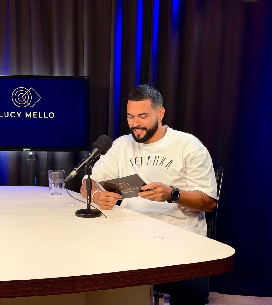 Arthur Pecos at the microphone during an interview — Life in Rhythm performance case